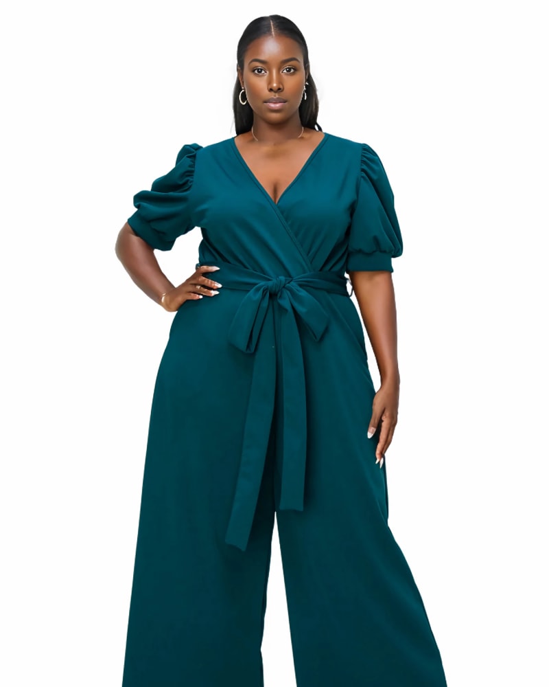 Front of a model wearing a size 3X Iris Wrap Pocket Jumpsuit in Green Hunter by L I V D. | dia_product_style_image_id:318581